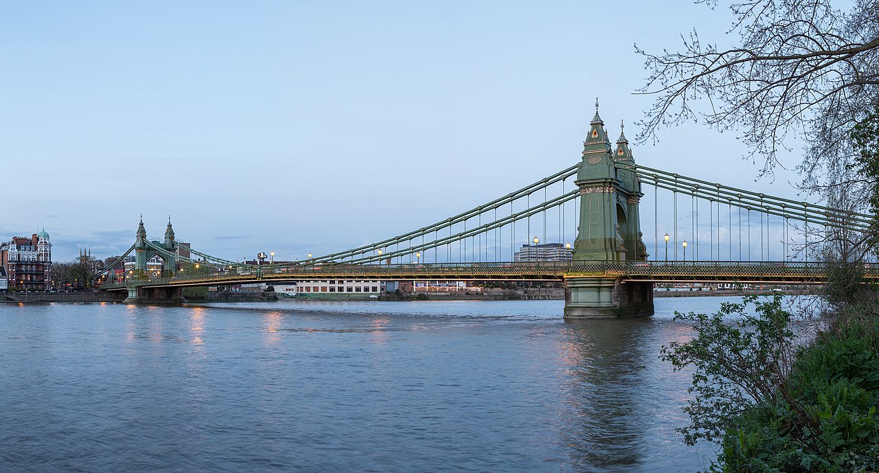Hammersmith Bridge spanning the River Thames, seen from Barnes